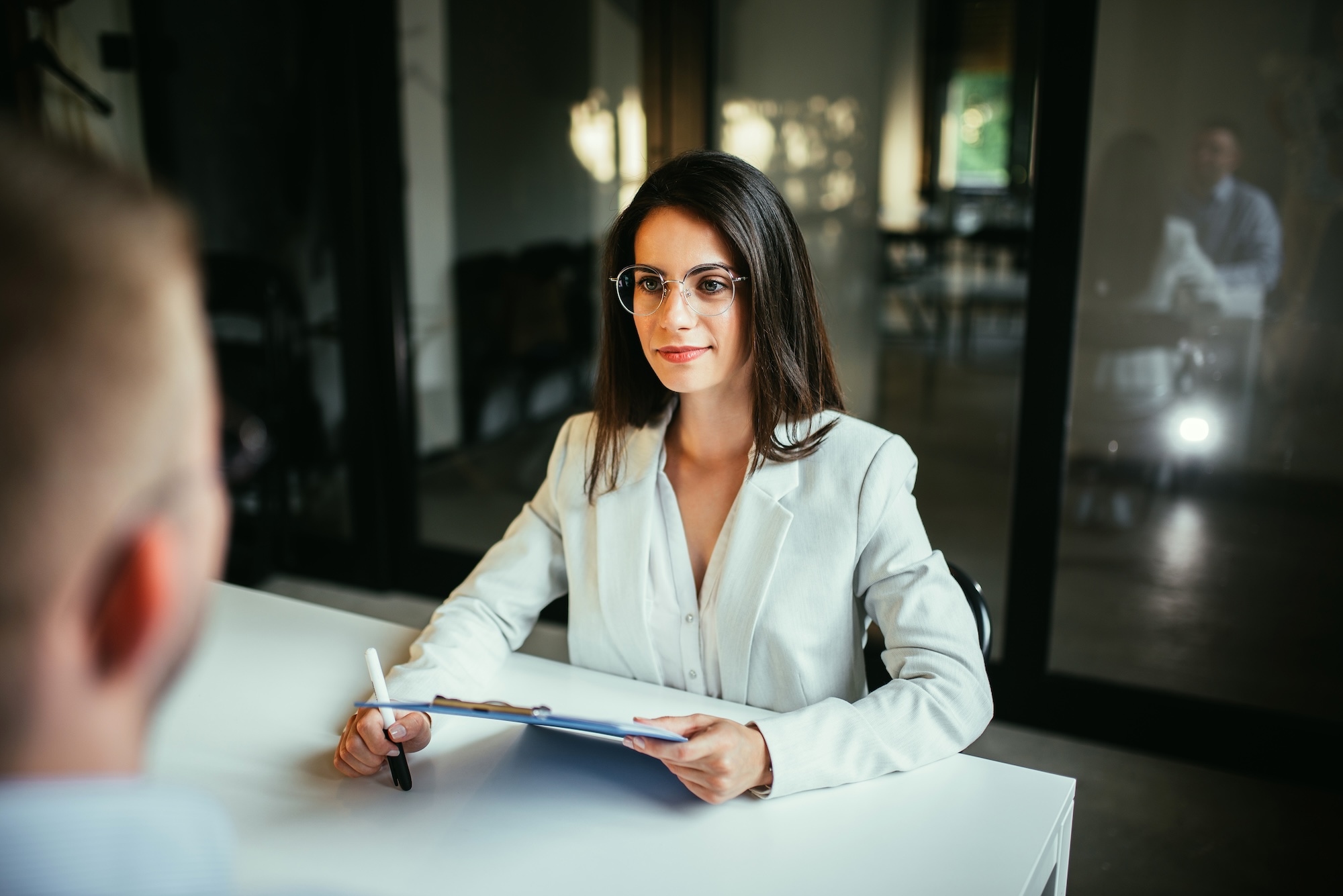 Beautiful female financial advisor on a meeting with a client.